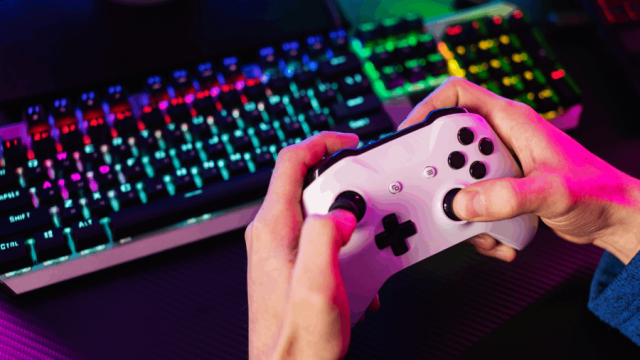 high-angle-hands-holding-controller