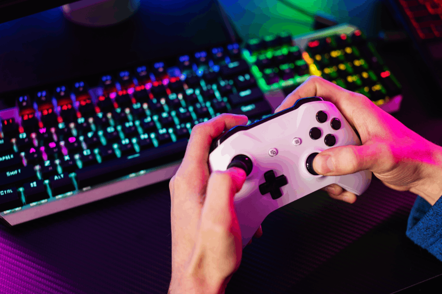 high-angle-hands-holding-controller