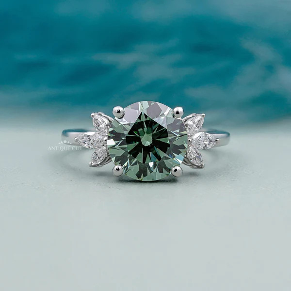 Round cut Antique Green Diamond Ring with Marquise Side Stone