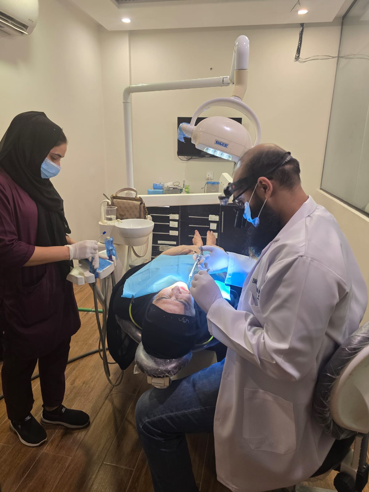 dentist-dr-furqan-performing-treatment