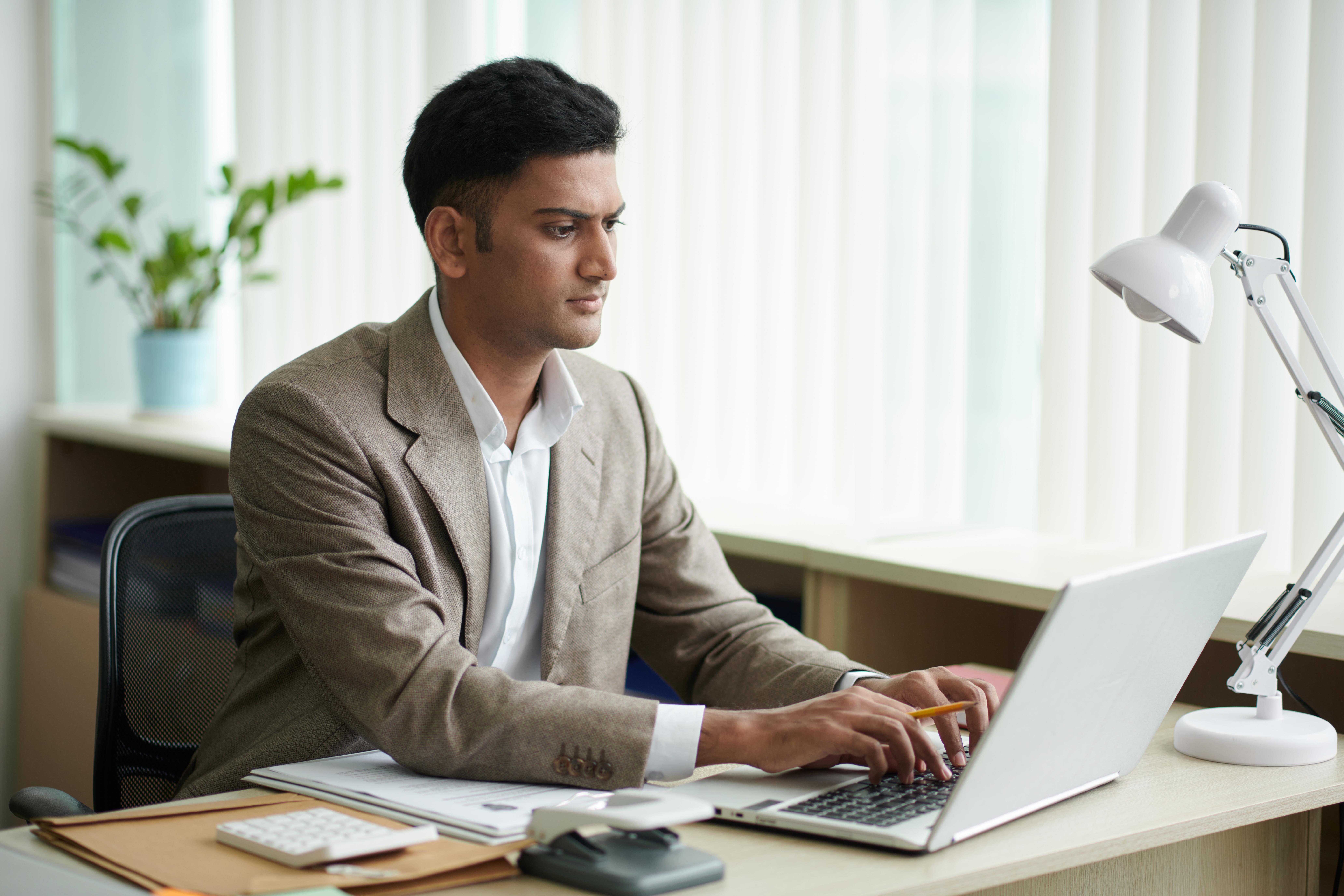 entrepreneur-working-office-desk-1-1