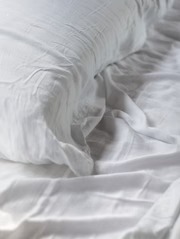 imgi_151_close-up-of-a-white-sheets-and-pillow-on-a-cozy-bed_180x