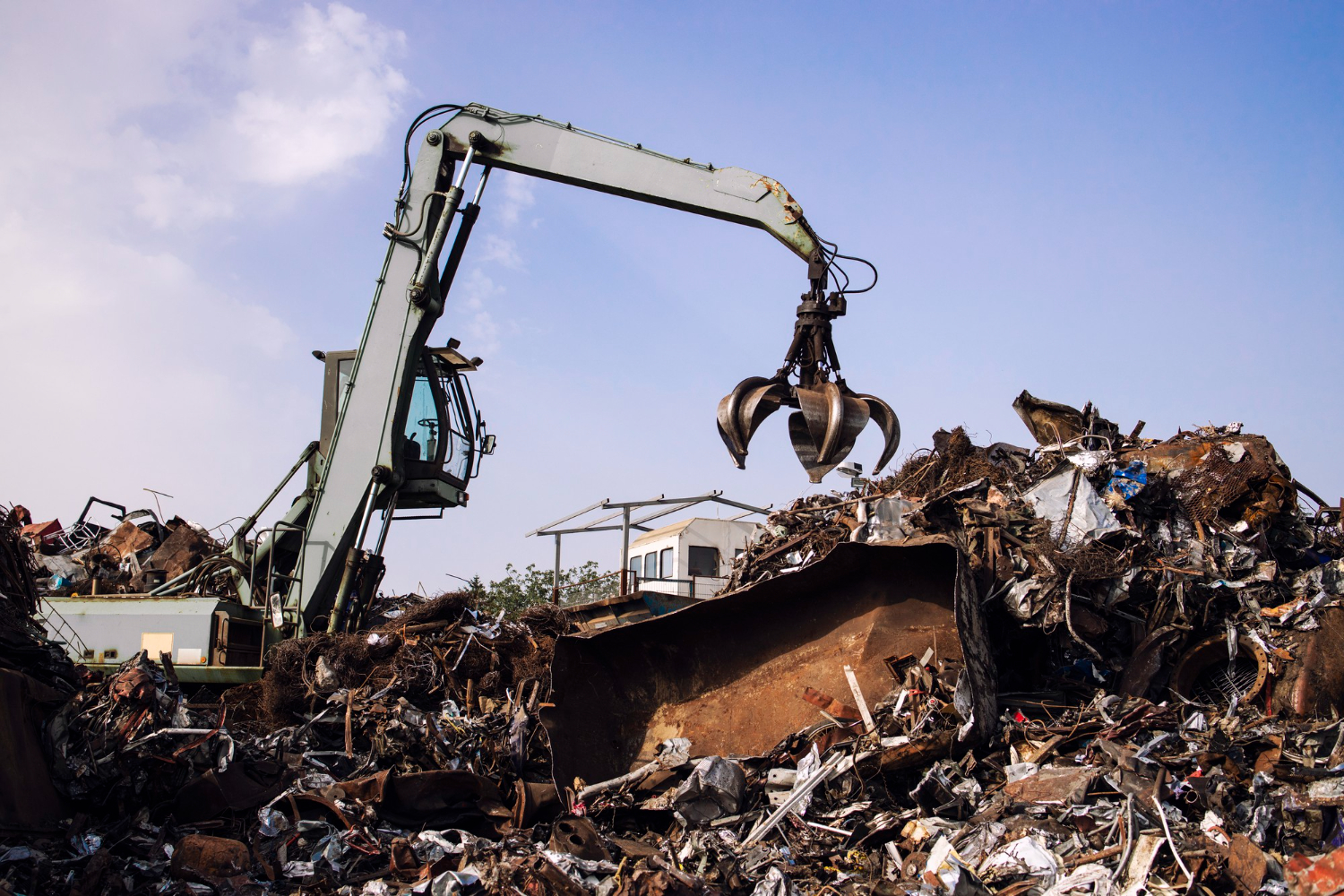 scrap-metal-recycling-yard-hydraulic-grab-excavator.jpg