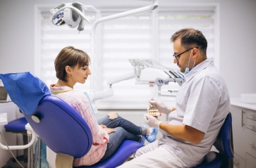 male-professional-dentist-with-gloves-mask-discuss-2